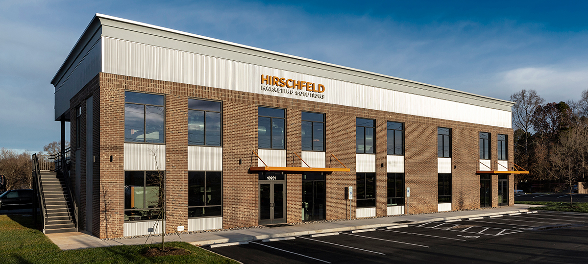 Hirschfeld building featuring a large company signage on the exterior.